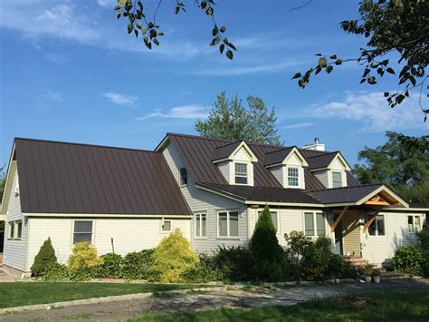 white house with bronze metal roof|residential white metal roof.